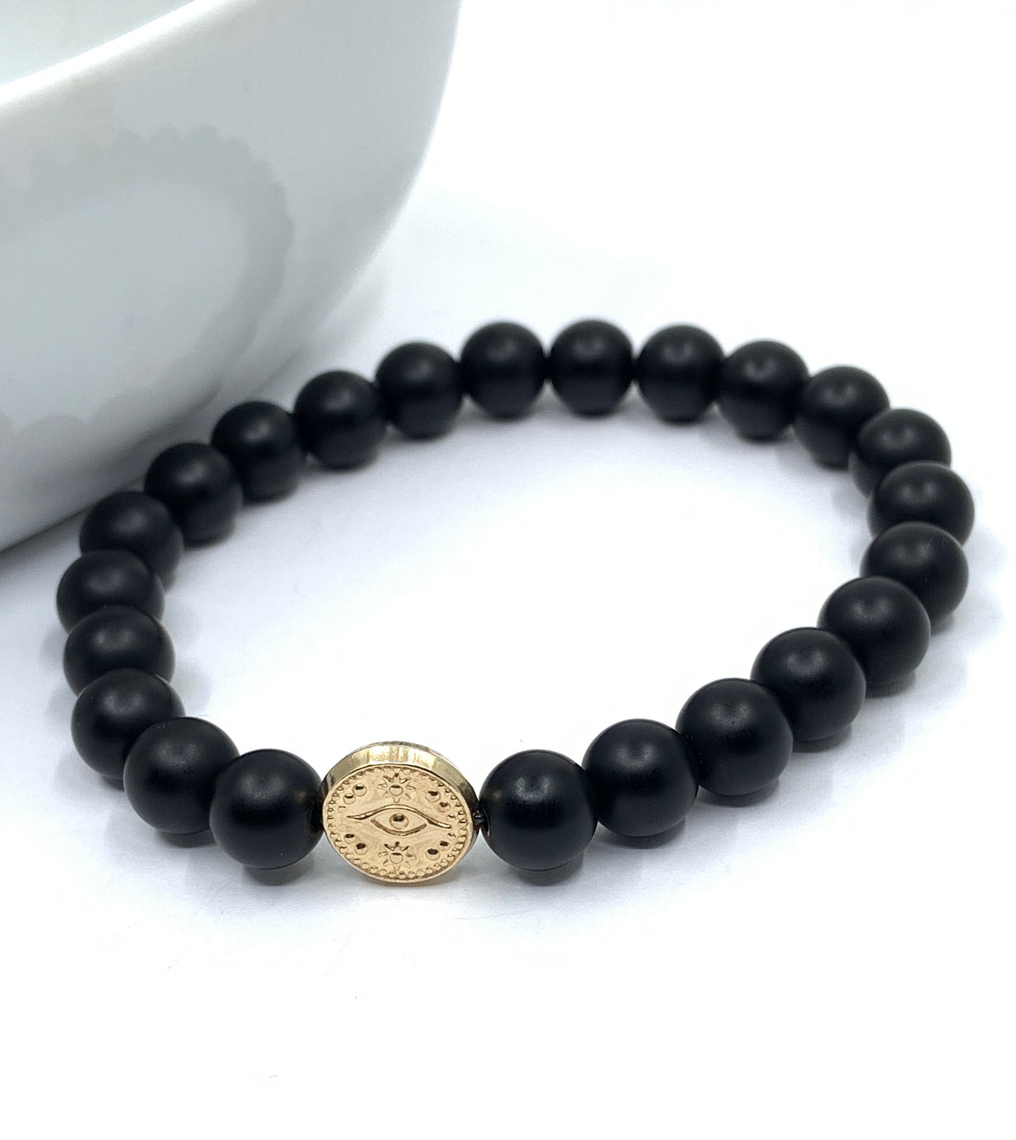 Matte Onyx bracelet with gold evil eye bead